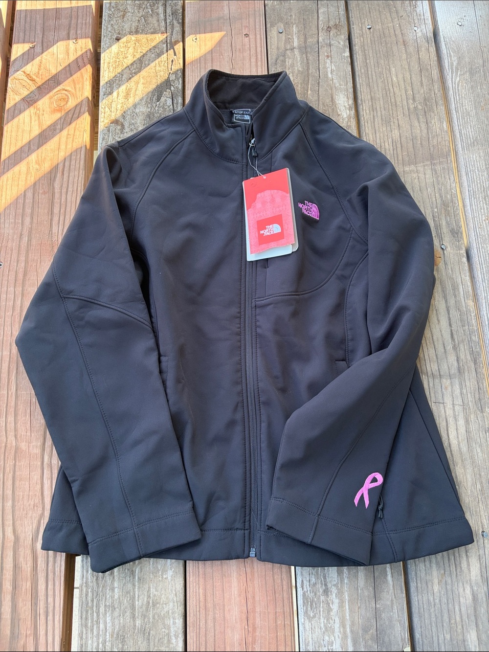 The North Face Women's Black Softshell Jacket with Pink Ribbon Accent